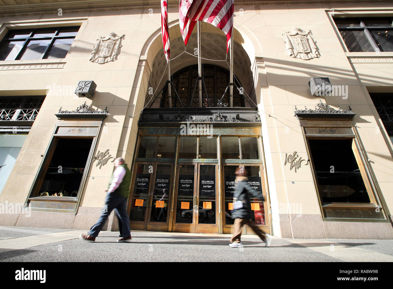 New York, USA. 3rd Jan, 2019. People walk past the closed Lord & Taylor flagship store on Fifth avenue in Manhattan, New York City, the United States, on Jan. 3, 2019. The famous department store chain Lord & Taylor officially closed its flagship store on Fifth avenue in Manhattan. The 11-storey building was a landmark on New York's most prestigious shopping area for over a century, boasting about its animated holiday windows and fine selection of jewelries and clothing and attracting city dwellers and tourists alike. Credit: Wang Ying/Xinhua/Alamy Live News Stock Photo