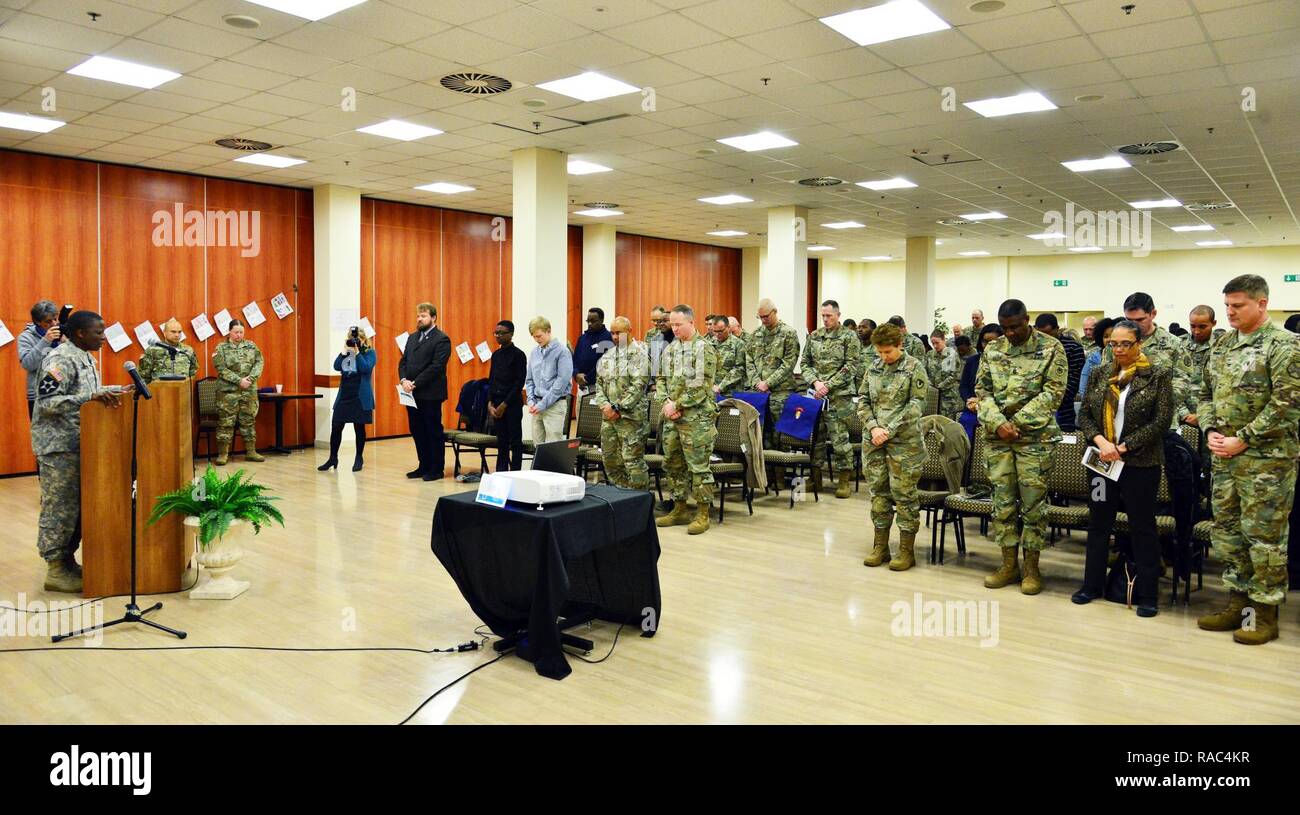 U.S. Army Master Sgt. T D (Terri) Gordon (far left), assigned to U.S. Army IMCOM, offers a prayer during Martin Luther King, Jr. Day observances, at Vicenza Military Community’s 2017 Observance Ceremony at Caserma Ederle, Vicenza, Italy, Jan. 10, 2017. Stock Photo