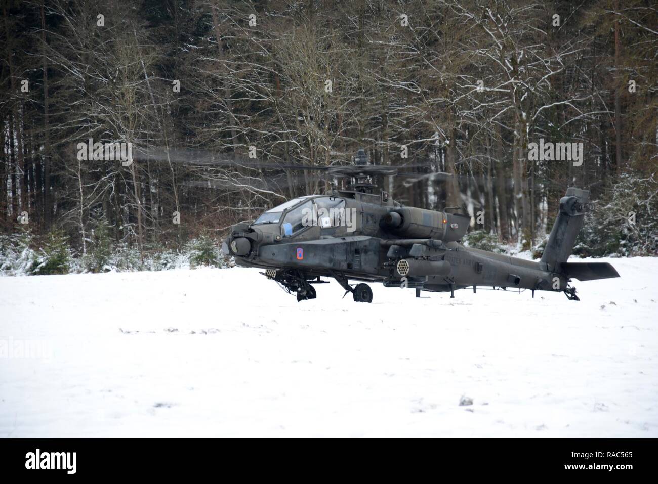 An AH 64D Apache Longbow attack helicopter crew, assigned to 12th Combat Aviation Brigade support the 3rd Squadron,  2nd Cavalry Regiment, initiates its first itinerary during the operation Dire Wolf at 7th Army Training Command’s, Grafenwoehr  Training Area, Bavaria, Germany, Jan. 10, 2017. Stock Photo