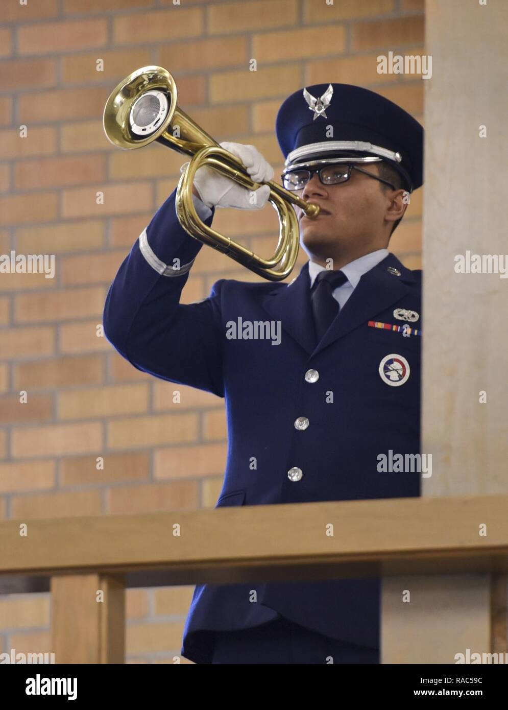 A member of Ellsworth’s Honor Guard performs Taps during Master Sgt
