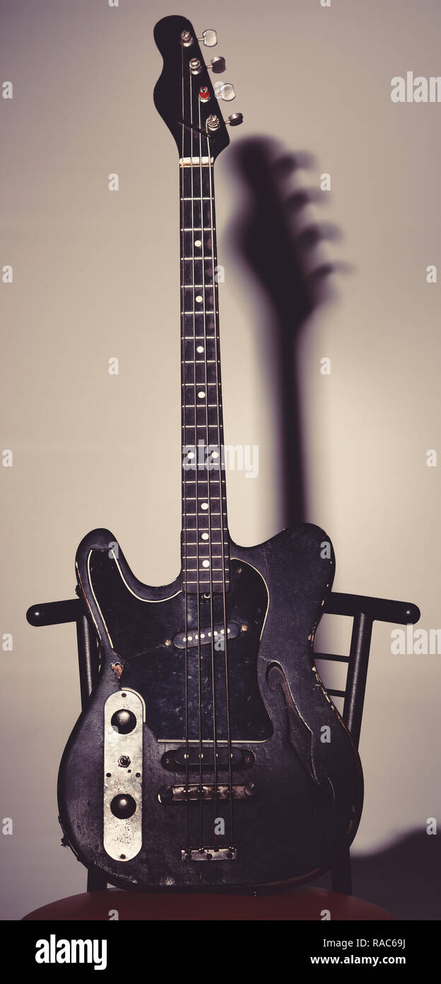 Musical instrument with four strings for playing metal or jazz music. Music and hard rock