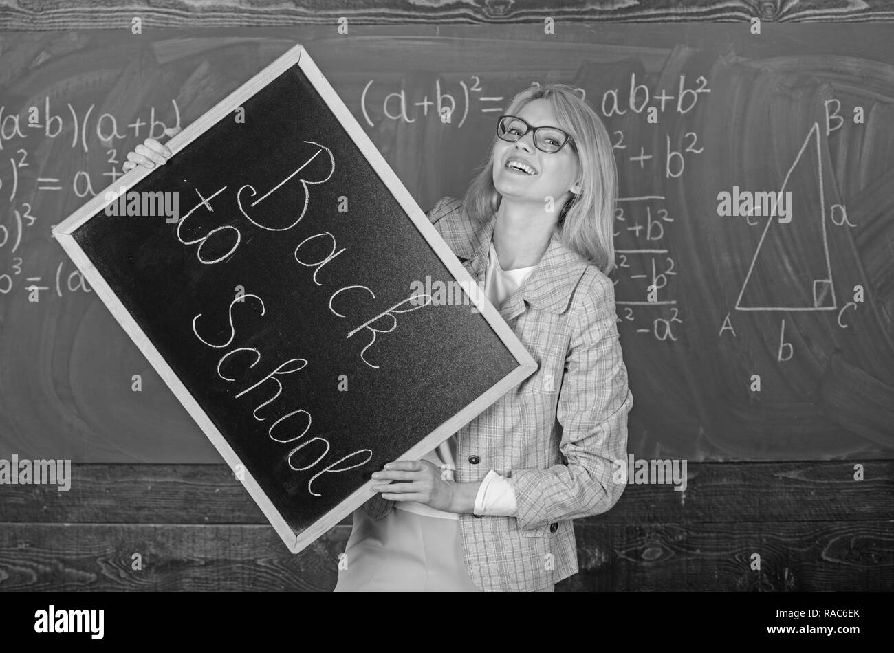 Hiring teachers for new school year. Woman teacher holds blackboard