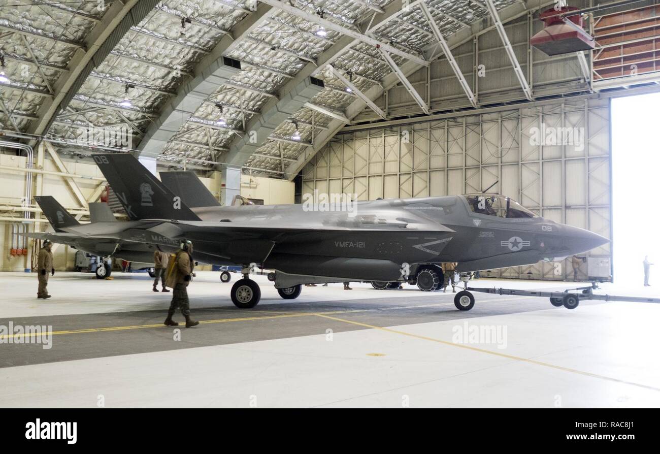 Marines assigned to Marine Fighter Attack Squadron (VMFA) 121, 3rd Marine Aircraft Wing, move F-35Bs in a hangar, Jan. 13, 2017, during a stop on Joint Base Elmendorf-Richardson, Alaska, en route to Marine Corps Air Station Iwakuni, Japan. VMFA-121 is the first operational F-35B squadron in the Marine Corps, with its relocation to 1st Marine Aircraft Wing at Iwakuni. The F-35B was developed to replace the Marine Corps’ F/A-18 Hornet, AV-8B Harrier and EA- 6B Prowler. The Short Take-off Vertical Landing (STOVL) aircraft is a true force multiplier. The unique combination of stealth, cutting-edge Stock Photo