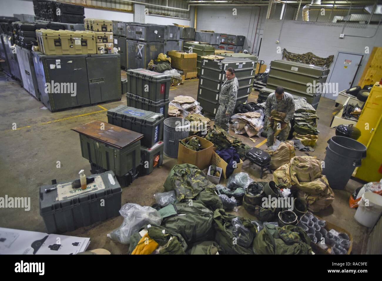 108th Security Forces Members inspect equipment in their storage facility before distribution at the 108th Wing, Joint Base McGuire-Dix-Lakehurst, N.J., Jan. 17, 2017. The Airmen prepare the gear for their activation to Washington D.C. in support of the 58th presidential inauguration. Stock Photo