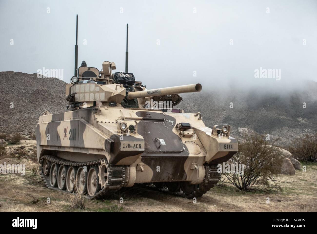 FORT IRWIN, CALIF. – An 11th Armored Cavalry Regiment Main Battle Tank surveys the battle field during Rotation 17-03, at the National Training Center, Jan. 20, 2017. T The purpose of this operation was to challenge 1st SBCT, 25th ID, to defend an urban area while also defending against large scale, peer-to-peer attacks in multiple areas. Stock Photo