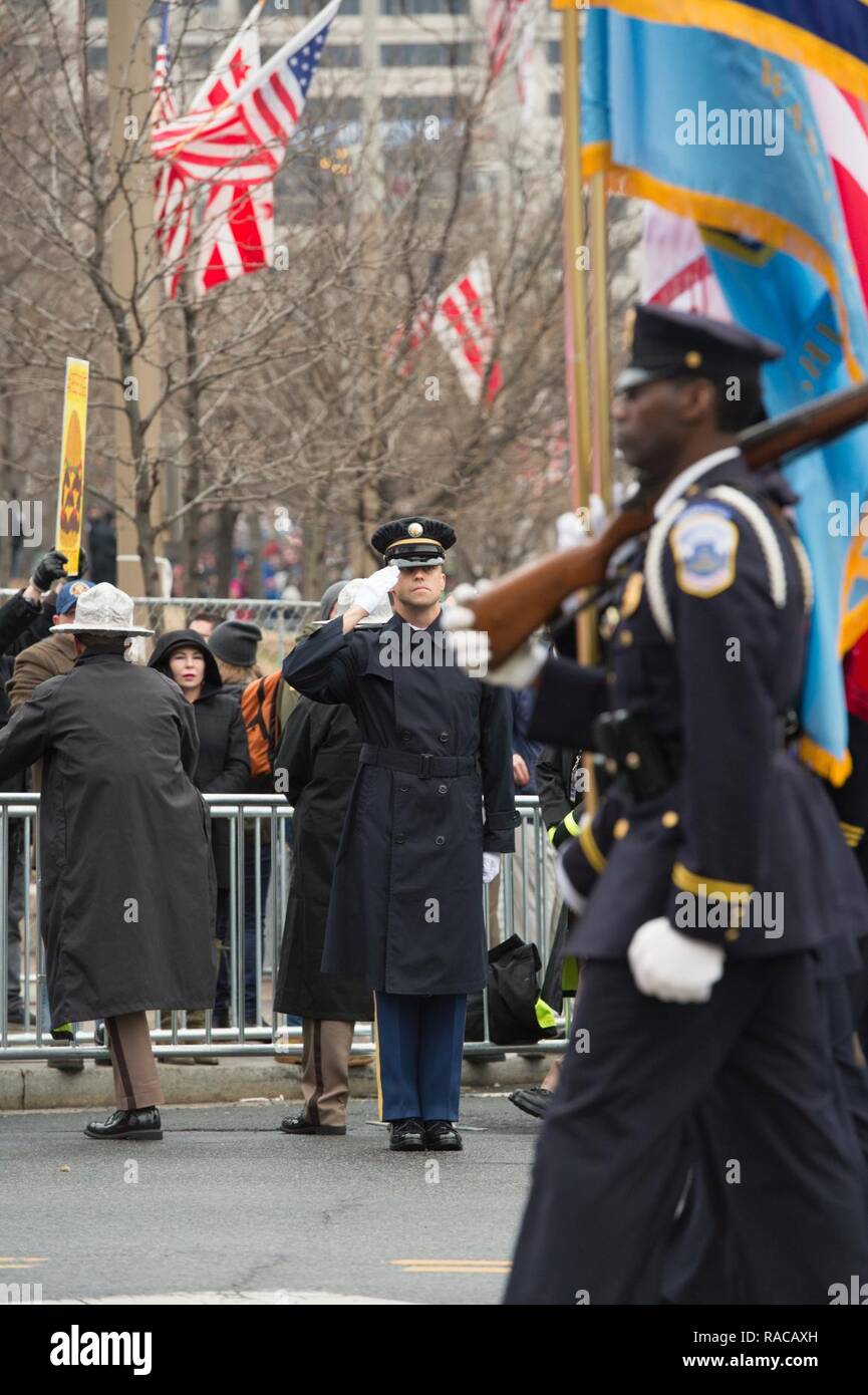 Service members from all five branches of the armed services carry a large  American flag out onto the field at the Salute to Service Chicago Bears  game Nov. 27 at Soldier Field