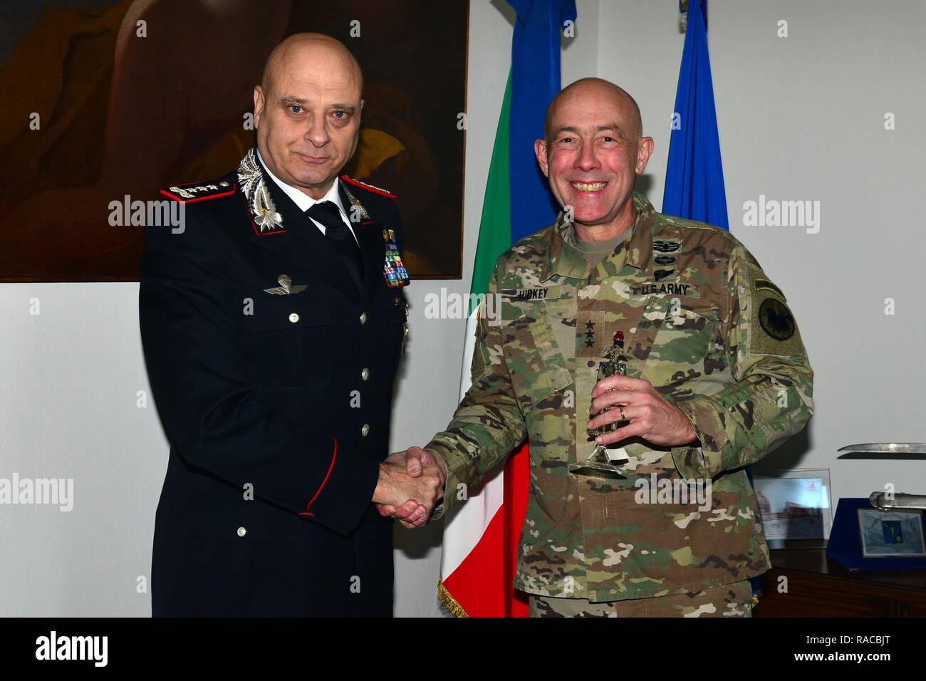 Lt. Gen Vincenzo Coppola (left), Commanding General “Palidoro” Carabinieri Specialized and Mobile Units, presents a gift at Lt. Gen. Charles D. Luckey (right), Commanding General U.S. Army Reserve Command, during visit at Center of Excellence for Stability Police Units (CoESPU) Vicenza, Italy, January 20, 2017. Stock Photo