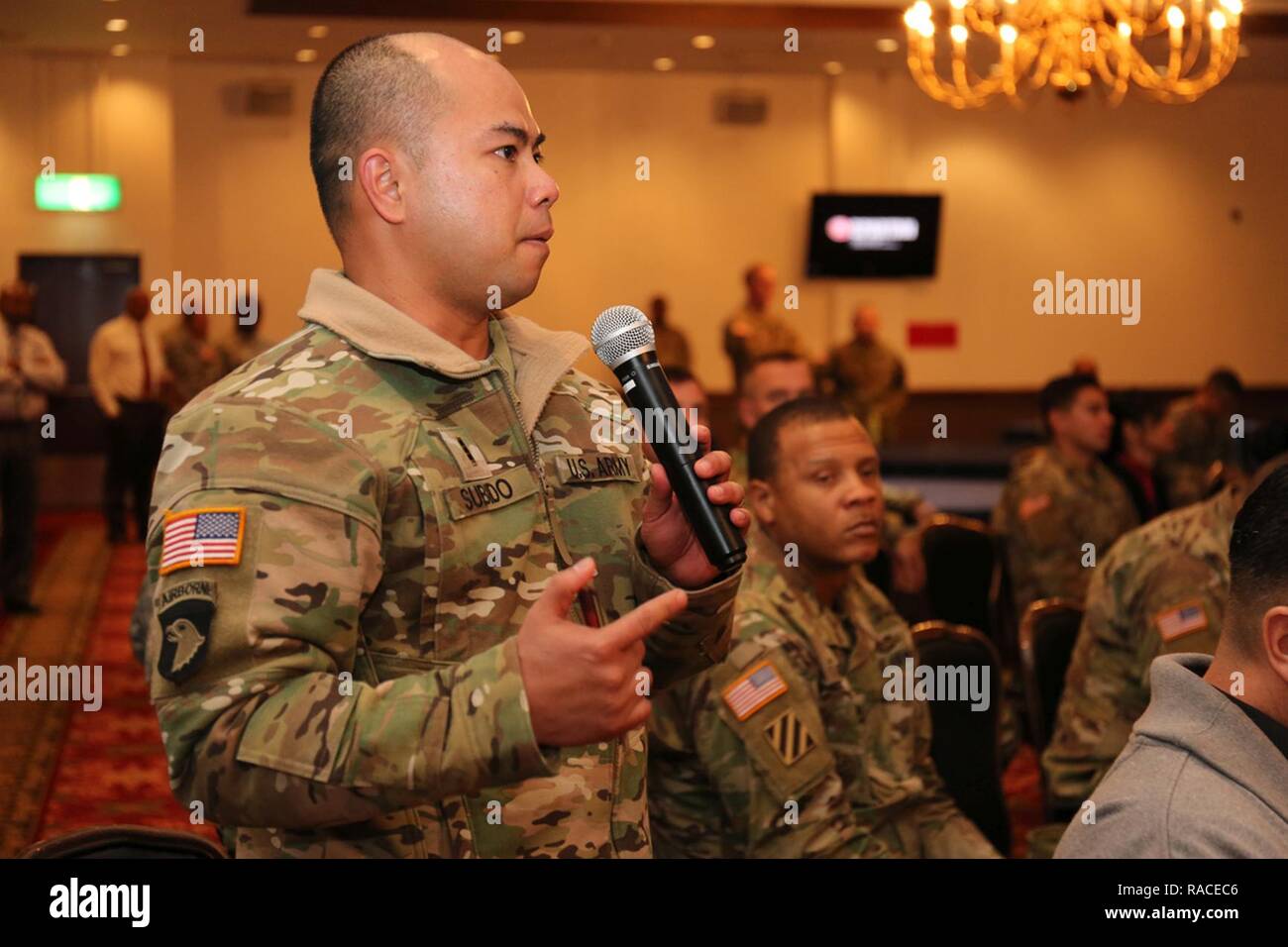 Chief Warrant Officer 3, Salvador Subido, assigned to U.S. Army Aviation Battalion Japan, asks one of the guest speakers a question about entrepreneurship during the Veteran Transition Conference 2017 hosted by the Camp Zama's Transition Service Center Jan. 18 at Camp Zama Community Club. Stock Photo