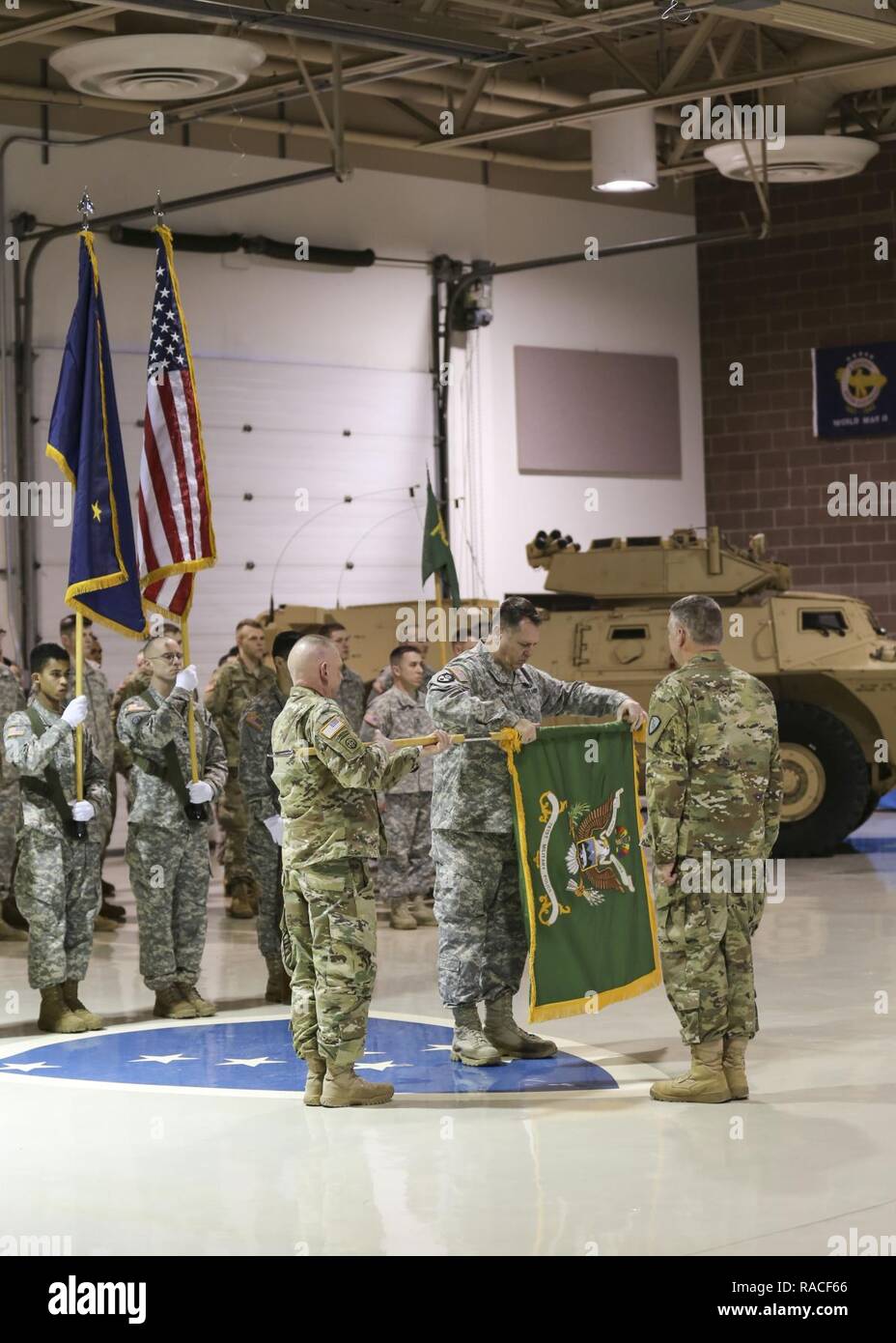 Lt. Col. James Palembas, 761st Military Police Battalion commander, holds the unit colors as Command Sgt. Maj. George Juelch, 761st MP BN command sergeant major, cases the colors signifying the unit's deactivation Jan. 22, 2017, at the Alaska National Guard Armory on Joint Base Elmendorf-Richardson. Stock Photo