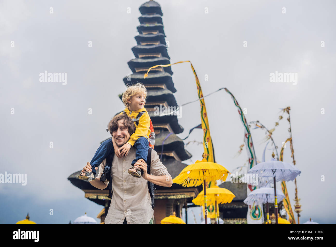 Dad And Son In The Background Of Pura Ulun Danu Bratan Bali
