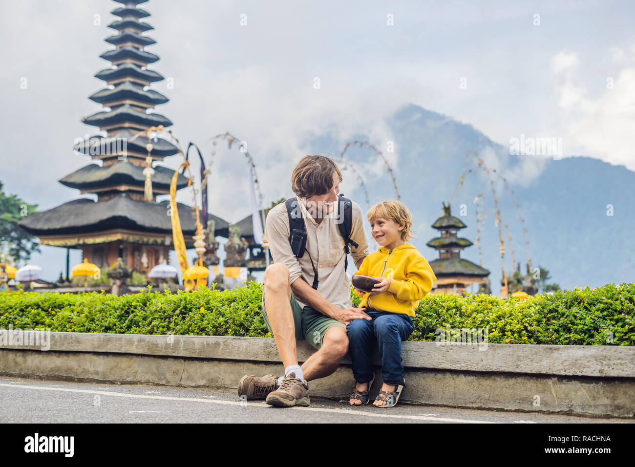 Dad And Son In The Background Of Pura Ulun Danu Bratan Bali