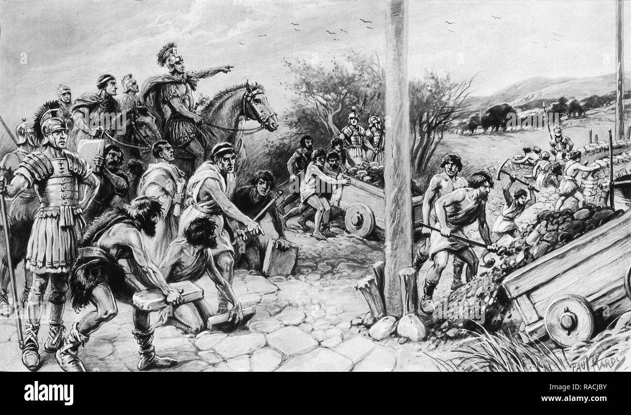 Roman soldiers direct the locals to build a road in Roman Britain. From an original painting by Paul Hardy. Stock Photo