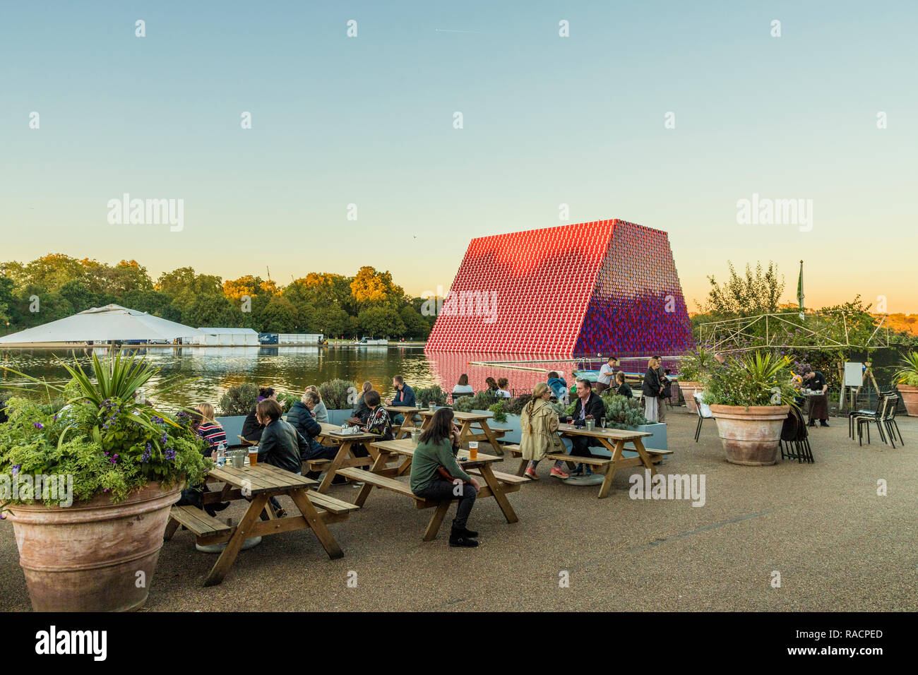 People relaxing in Hyde Park with The London Mastaba sculpture in the background, London, England, United Kingdom, Europe Stock Photo