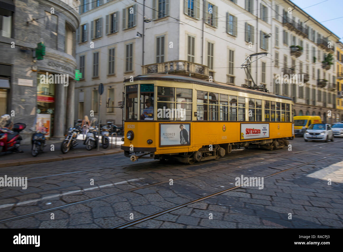 City tram passing on Via Alessandro Manzoni, Milan, Lombardy, Italy, Europe Stock Photo