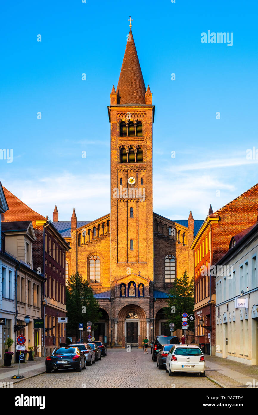 Potsdam, Brandenburg / Germany - 2018/07/29: Historic old town quarter with main shopping street Brandenburger Strasse and St. Peter and Paul Church Stock Photo