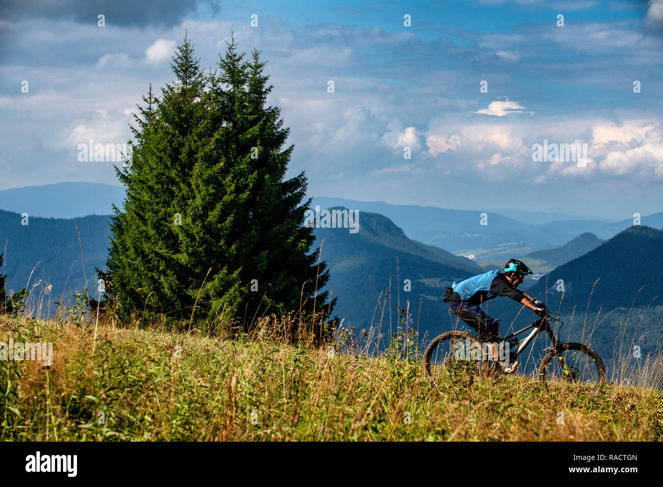 A man rides a mountain bike at Malinô Brdo bike park near Ružomberok in Slovakia. Stock Photo