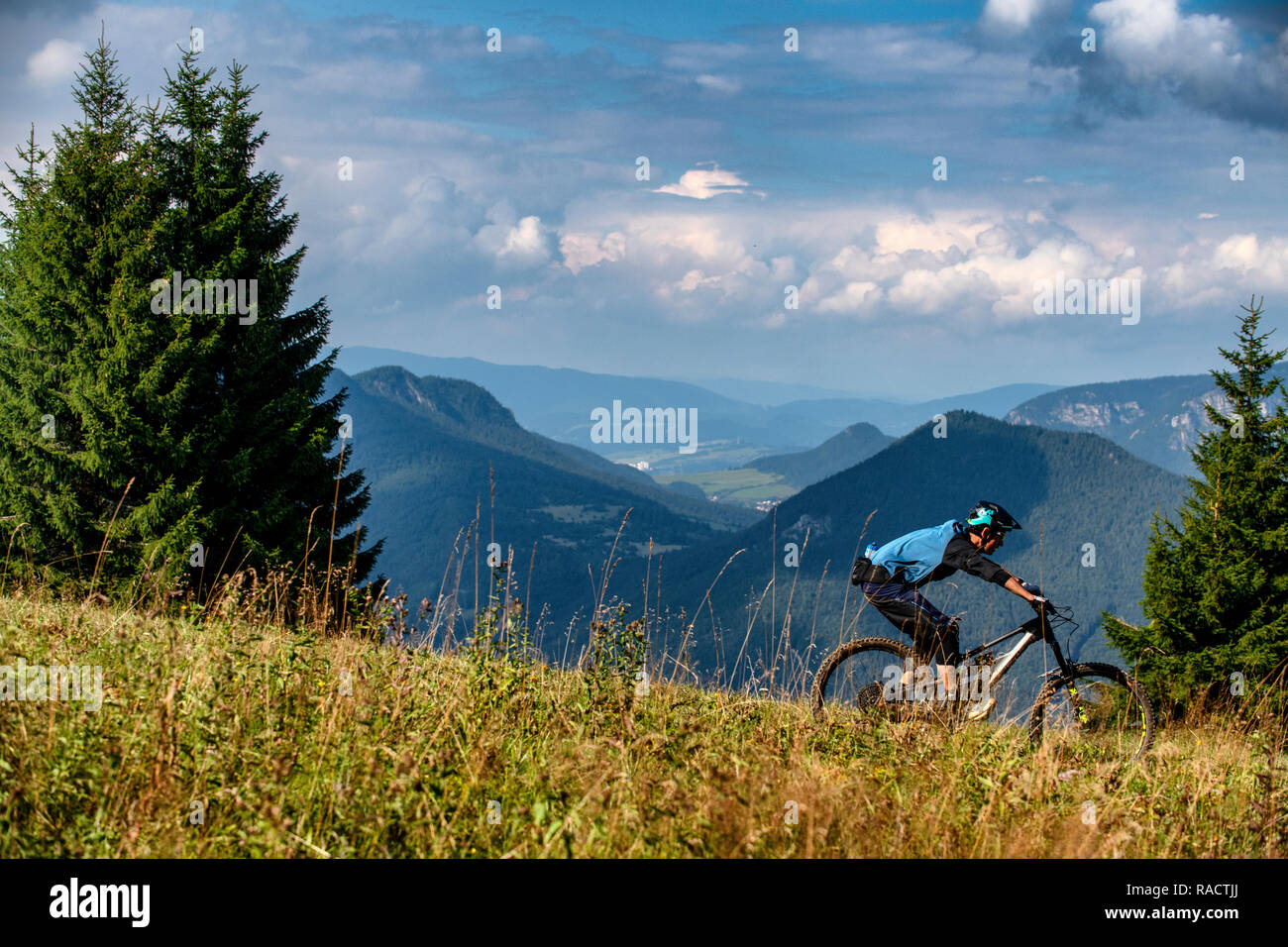 A man rides a mountain bike at Malinô Brdo bike park near Ružomberok in Slovakia. Stock Photo