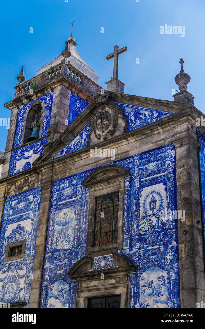 Facade of Chapel of Souls, covered with azulejo blue and white painted ceramic tiles, Capela das Almas Church, Porto, Portugal, Europe Stock Photo