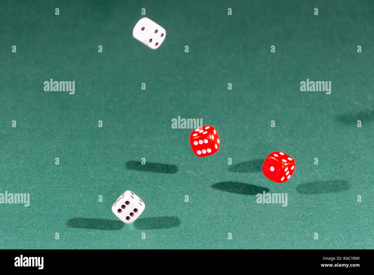White, red and blue dices falling Stock Photo