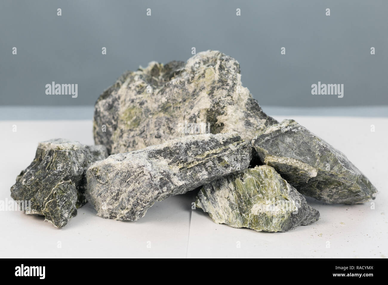 Mineral asbestos in the composition of the stone enclosing rock Stock ...