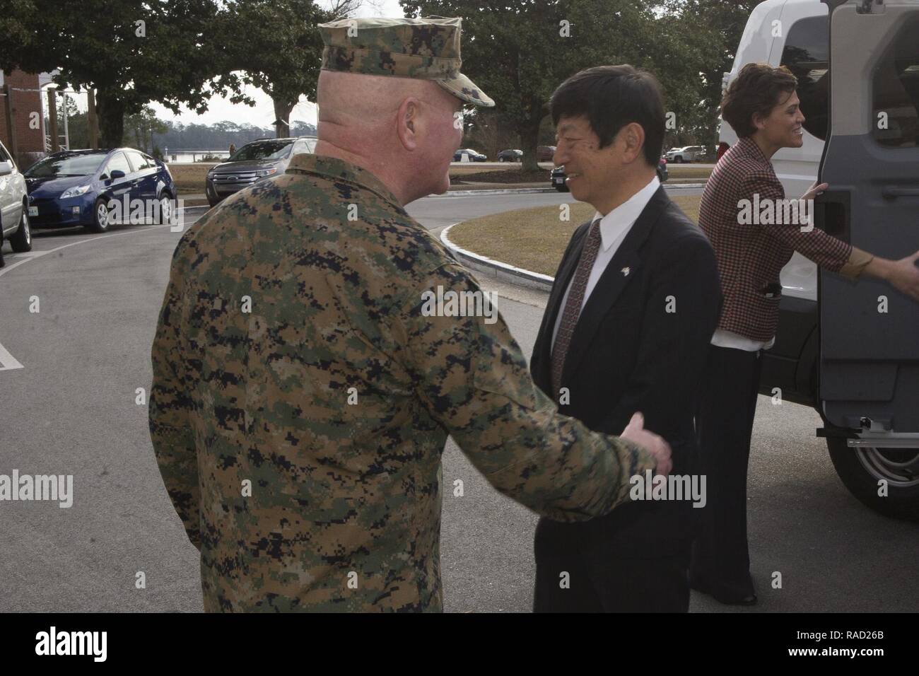 U.S. Marine Corps Maj. Gen. Walter L. Miller Jr., commanding general, II Marine Expeditionary Force (II MEF), greets Consul General for Japan Takashi Shinozuka during a visit to Camp Lejeune, N.C., Jan. 20, 2017. The purpose of the visit was to provide Consul General Shinozuka an opportunity to meet with senior leadership of II MEF as well as a familiarization overview of the MV-22 Osprey training syllabus that Japanese pilots are undergoing at Marine Corps Air Station New River. Stock Photo