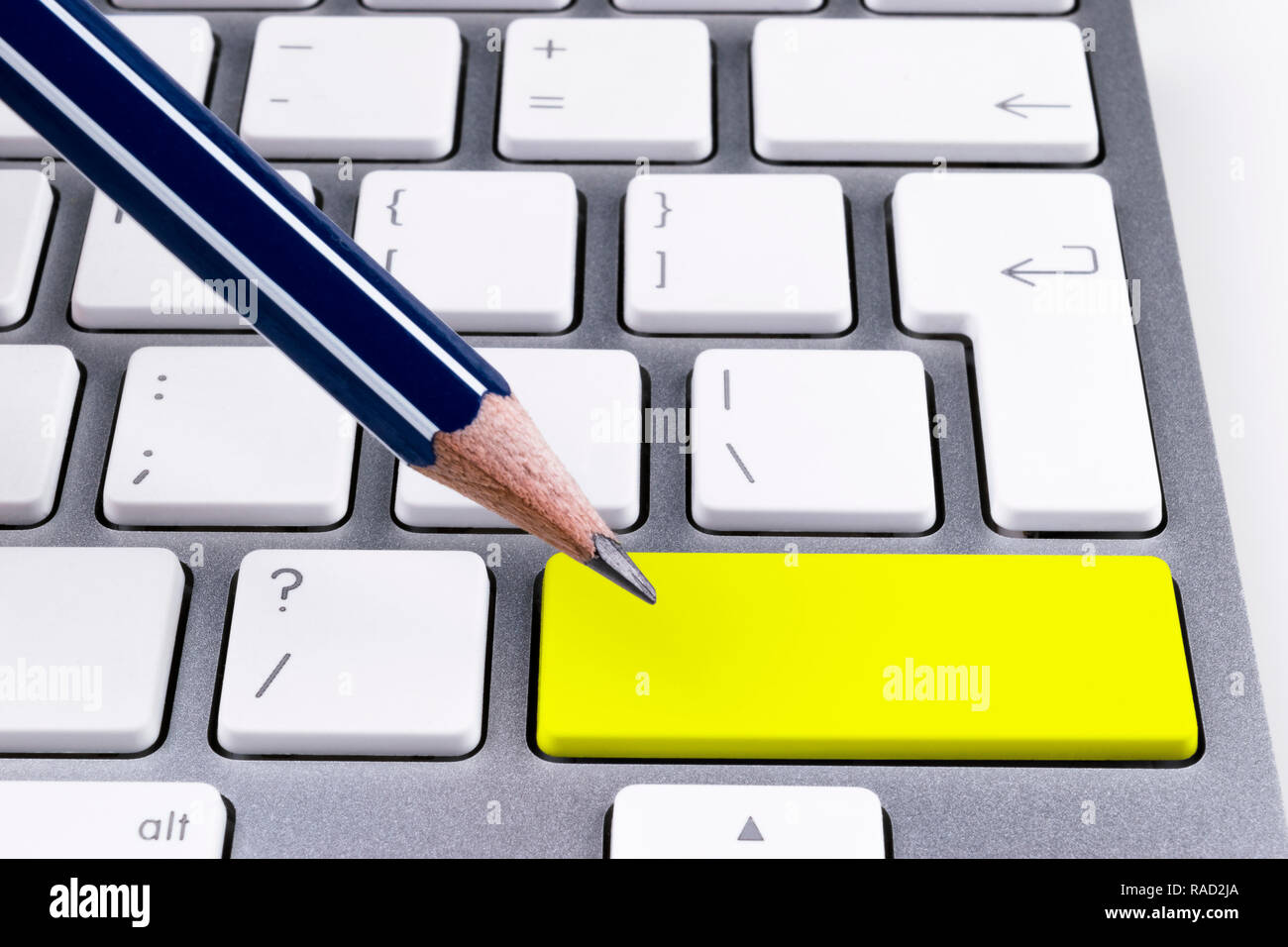 Close up view of a Computer notebook keyboard with a pencil and one ...
