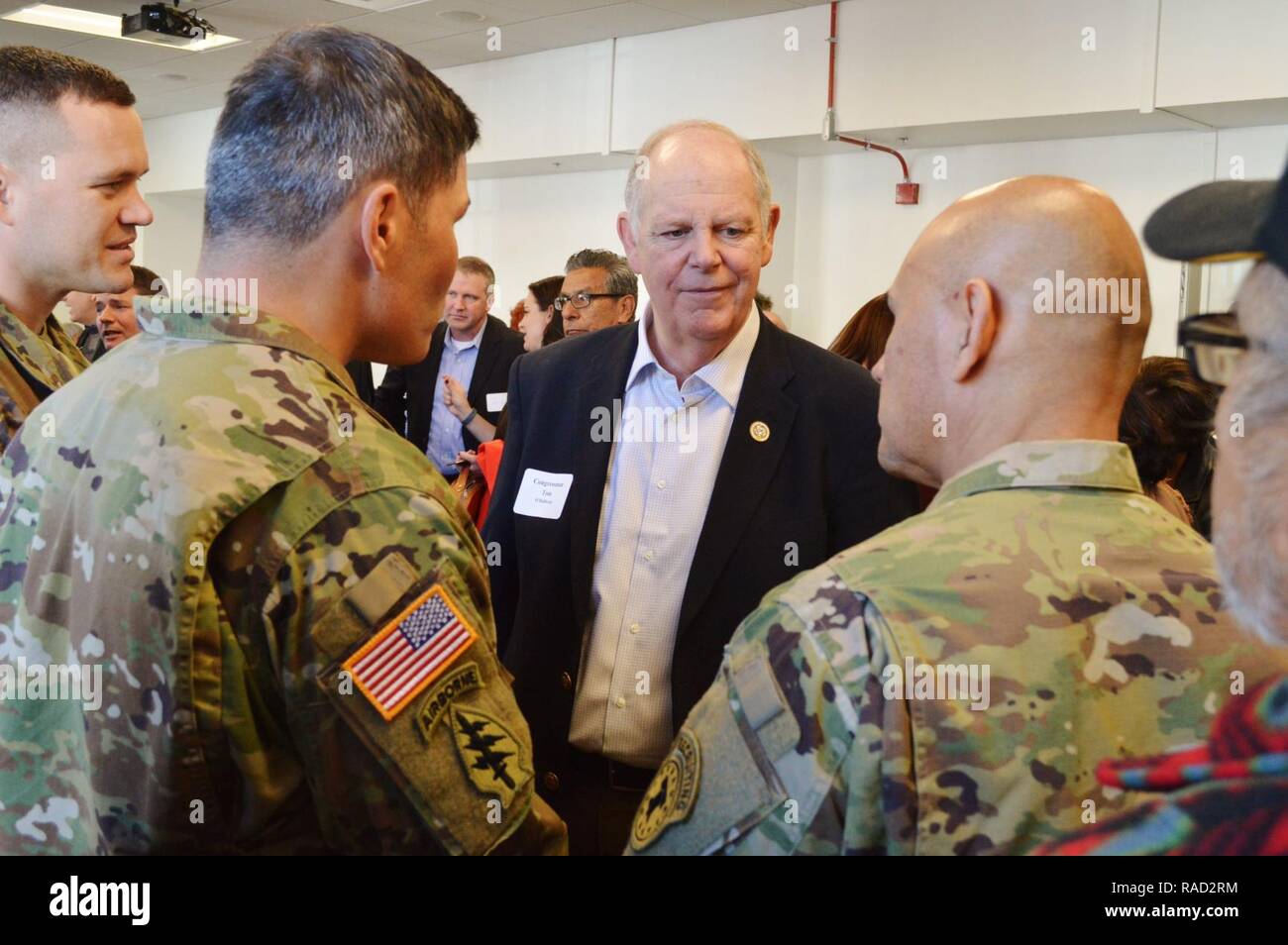 Capt. Adam McGinnis (far left), commander, Phoenix Central Company, Lt. Col. David Clukey (second left), battalion commander, Phoenix Recruiting Battalion, and Command Sgt. Maj. Jose Gomez (right), command sergeant major, Phoenix Rec. Bn. talk with Congressman Tom O' Halleran (center), 1st Congressional District of Arizona, prior to a ceremony at the Phoenix Downtown Post Office, Jan. 27.    The event provided an opportunity for the leadership to expand their relationships with members of the local community, which also included Congressman Ruben Gallego, 7th District of Arizona , and Democrat Stock Photo