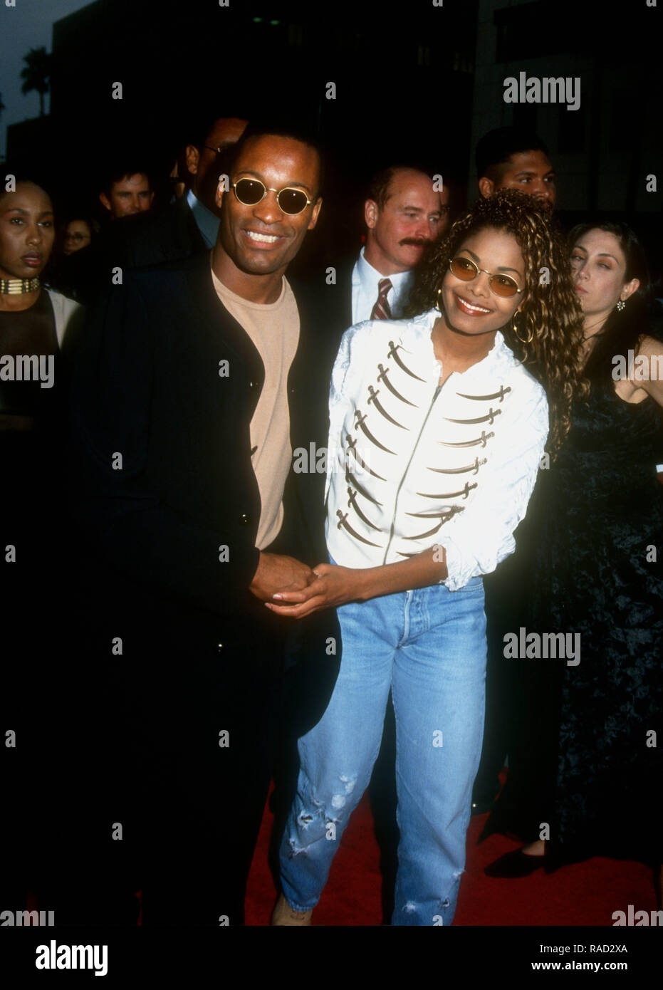 BEVERLY HILLS, CA - JULY 21: Director/writer/producer John Singleton and singer Janet Jackson attend Columbia Pictures' 'Poetic Justice' Premiere on July 21, 1993 at the Samuel Goldwyn Theatre in Beverly Hills, California. Photo by Barry King/Alamy Stock Photo Stock Photo