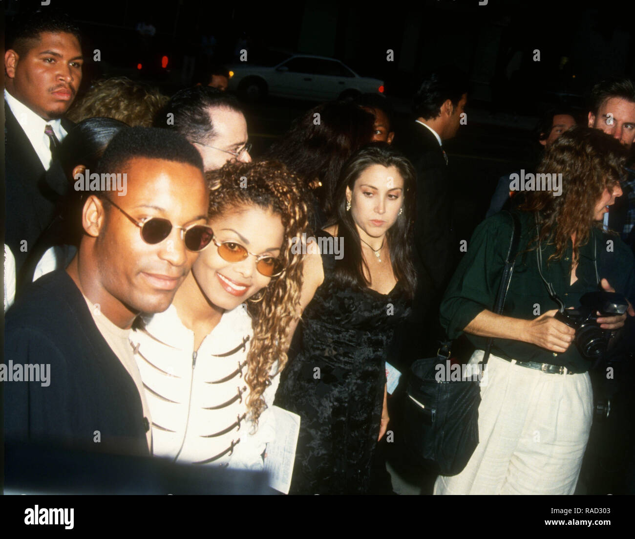 BEVERLY HILLS, CA - JULY 21: Director/writer/producer John Singleton and singer Janet Jackson attend Columbia Pictures' 'Poetic Justice' Premiere on July 21, 1993 at the Samuel Goldwyn Theatre in Beverly Hills, California. Photo by Barry King/Alamy Stock Photo Stock Photo