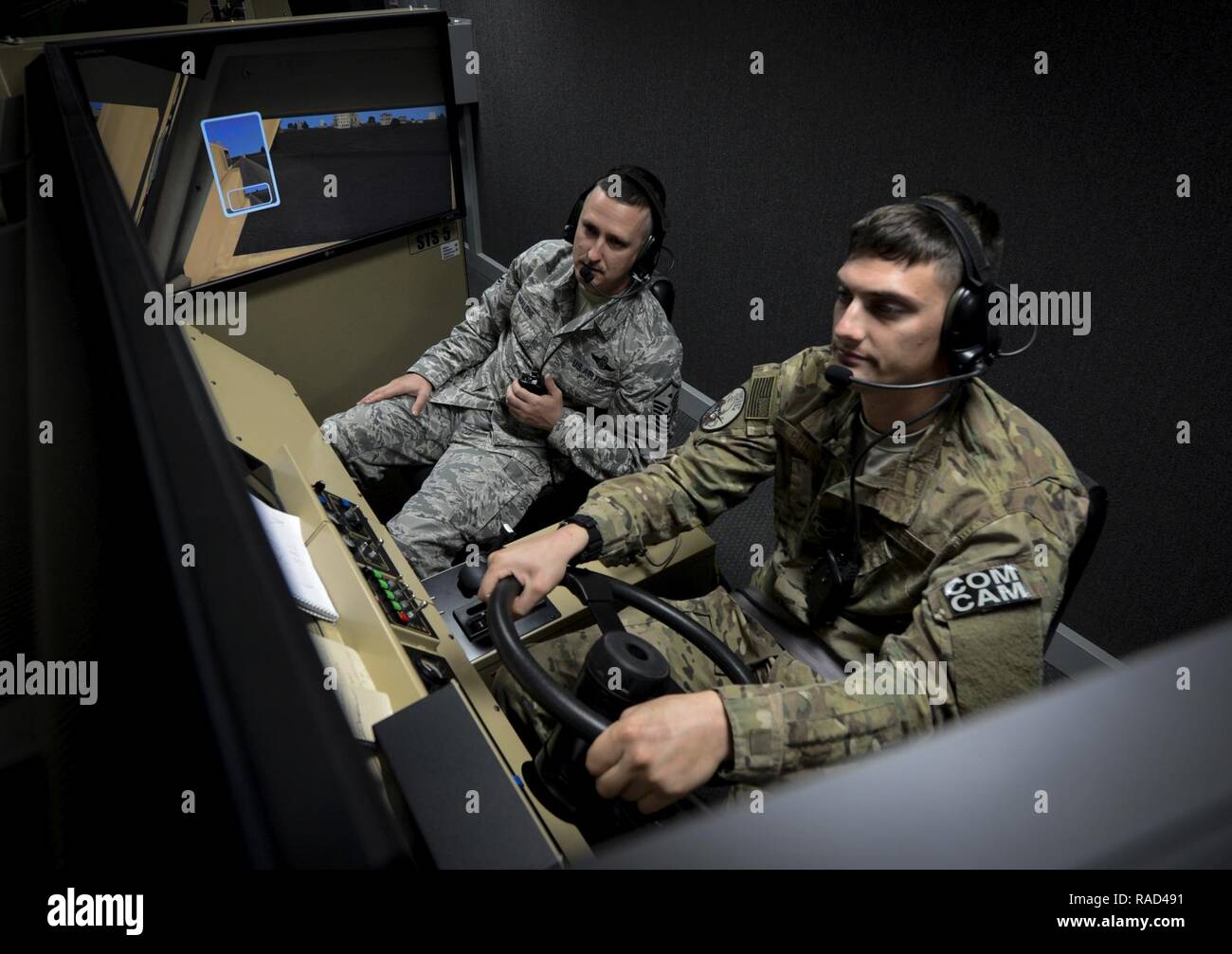 U.S. Air Force Master Sgt. Jon Malone, 1st Combat Camera Squadron combat first sergeant and Staff Sgt. Nicholas Priest, 1st CTCS combat broadcaster, participate in a convoy mission simulation a part of Exercise Scorpion Lens Jan. 26, 2017, at McCrady Training Center, S.C. Exercise Scorpion Lens is an annual Ability To Survive and Operate training exercise mandated by Air Force Combat Camera job qualification standards. Held at the United States Army Training Center Fort Jackson, S. C., and the McCrady Training Center, Eastover, S.C. the exercise’s purpose is to provide refresher training to co Stock Photo