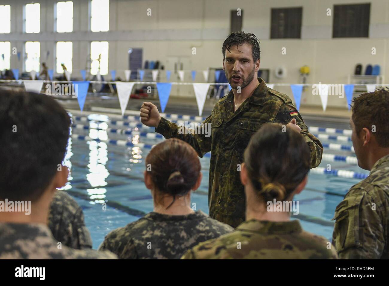 JACKSONVILLE, Fla. (Jan. 26, 2017) Sergeant Major (Oberstabsfeldwebel in German) Carsten Dreblow, a German Army liaison stationed in Fort Benning, Ga., speaks to U.S. Army soldiers while administering the German Armed Forces Proficiency Badge (GAFPB) fitness test.  The GAFPB is a decoration of Bundeswehr, the Armed Forces of the Federal Republic of Germany, and can be awarded to all German and allied service members of any rank. Stock Photo