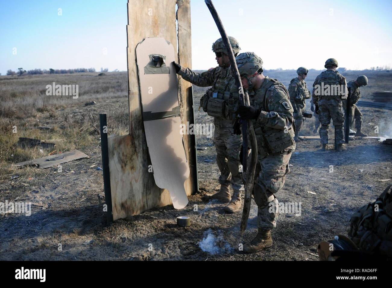 U.S. Army paratroopers from 54th Brigade Engineer Battalion, 173rd Airborne Brigade, inspect targets after detonation at the Urban Breaching Range at Foce Reno Italian training area, Ravenna, Italy, Jan 24, 2017. ( Stock Photo