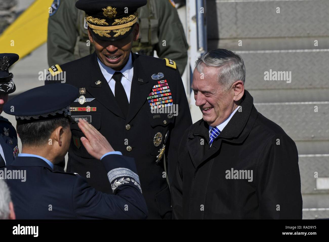 Defense Secretary Jim Mattis greets ROK air force Lt. Gen. Won, In-Choul, ROKAF Operations Command commander, as he arrives at Osan Air Base, Republic of Korea, Feb. 2, 2017. Mattis’ visit to the ROK, the first such visit in his tenure as secretary of defense, comes in light of a year of strong provocations from North Korea, affirming the ironclad commitment the U.S. has in strengthening its robust alliance with the ROK. Stock Photo