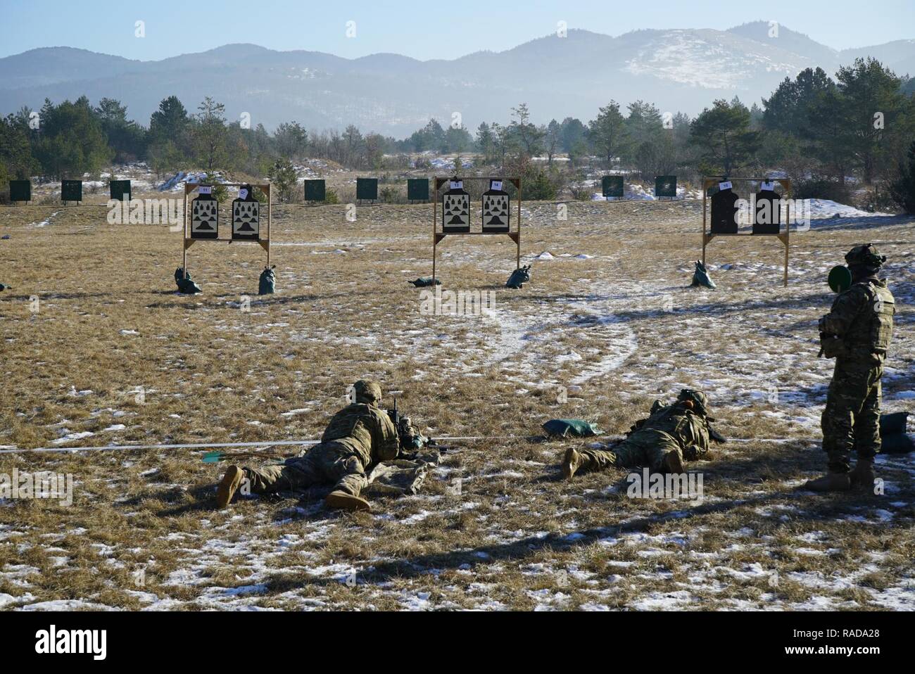 U.S. Army paratroopers from the 173rd Brigade Support Battalion, 173rd Airborne Brigade conduct M4 carbine weapons qualification during exercise Lipizzaner III in Bac, Slovenia, on Jan. 24, 2017. Lipizzaner is a combined squad-level training exercise in preparation for platoon evaluation, and to validate battalion-level deployment procedures. Stock Photo