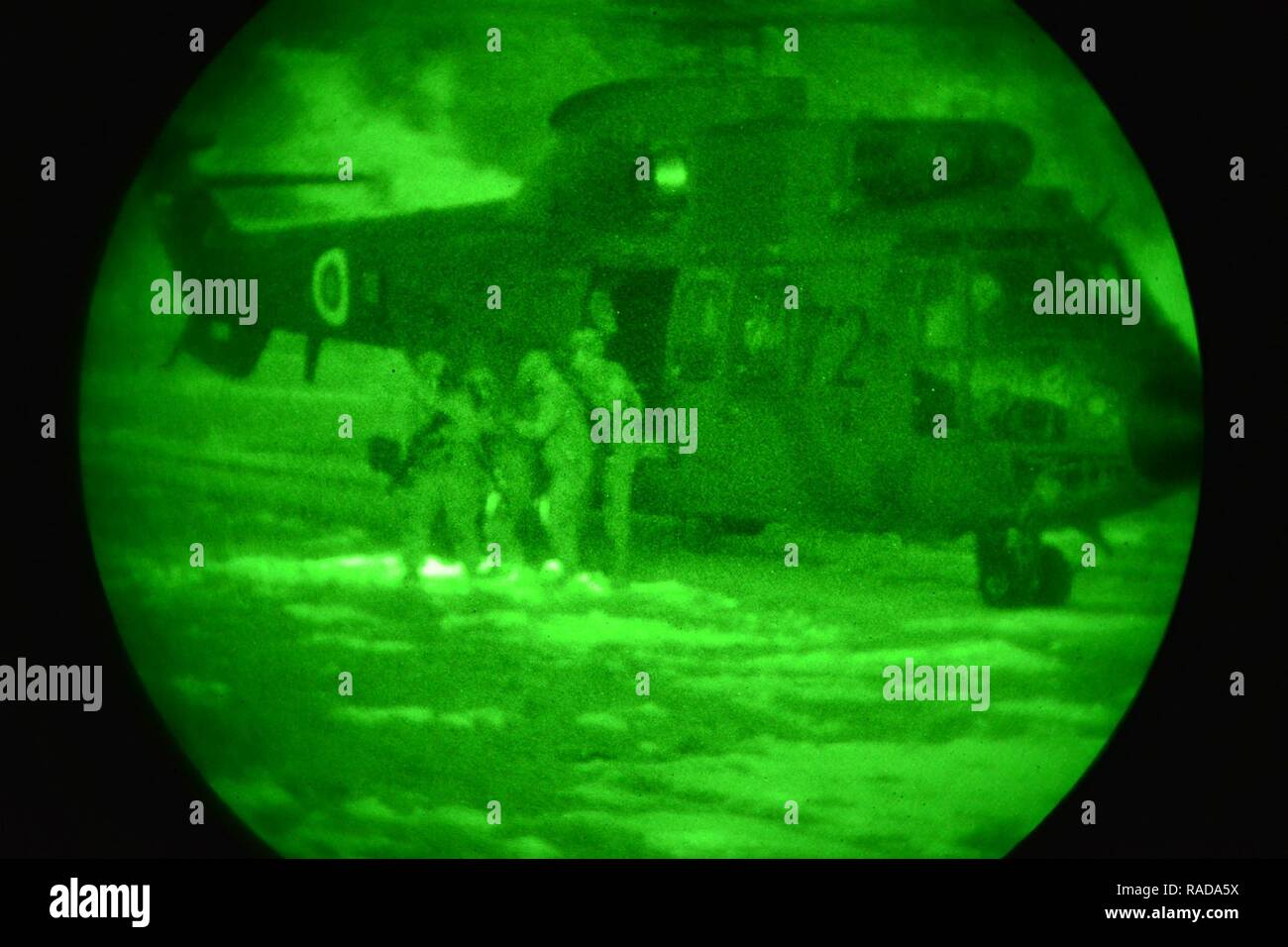 U.S. Army paratroopers from the 173rd Brigade Support Battalion, 173rd Airborne Brigade, conduct night casualty evacuation training with Slovenian Air Force Eurocopter H3-72 during exercise Lipizzaner III in Pocek, Slovenia, Jan. 28, 2017. Lipizzaner is a combined squad-level training exercise in preparation for platoon evaluation, and to validate battalion-level deployment procedures. Stock Photo