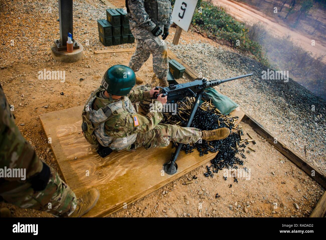 (FORT BENNING, GA) - Spent brass and ammo links pile up under the M2 as rounds are expended. Several different types of ammunition have been used in the M2 to include standard ball, armor-piercing, armor-piercing incendiary, and armor-piercing incendiary tracer rounds. Stock Photo