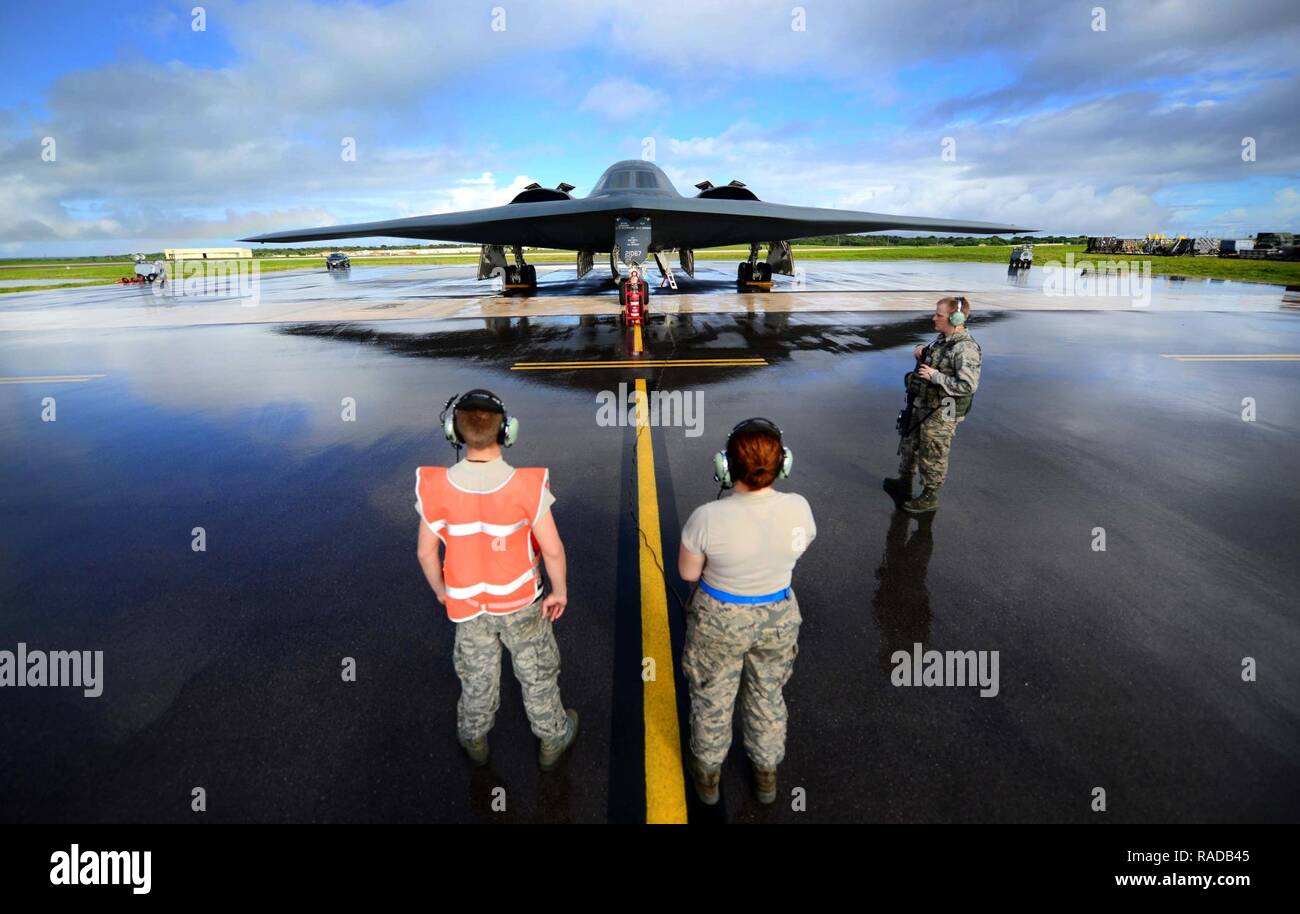 U.S. Air Force maintenance technicians assigned to the 509th Aircraft Maintenance Squadron, Whiteman Air Force Base, Mo., communicate with a B-2 Spirit pilot during pre-flight checks prior to a local training mission at Anderson Air Force Base, Guam Jan. 12, 2017. Close to 200 Airmen from Whiteman Air Force Base, Mo., and Barksdale Air Force Base, La., deployed to Andersen AFB, in support of U.S. Strategic Command Bomber and Deterrence missions. USSTRATCOM bomber missions familiarize aircrew with airbases and operations in different Geographic Combatant Commands. Stock Photo