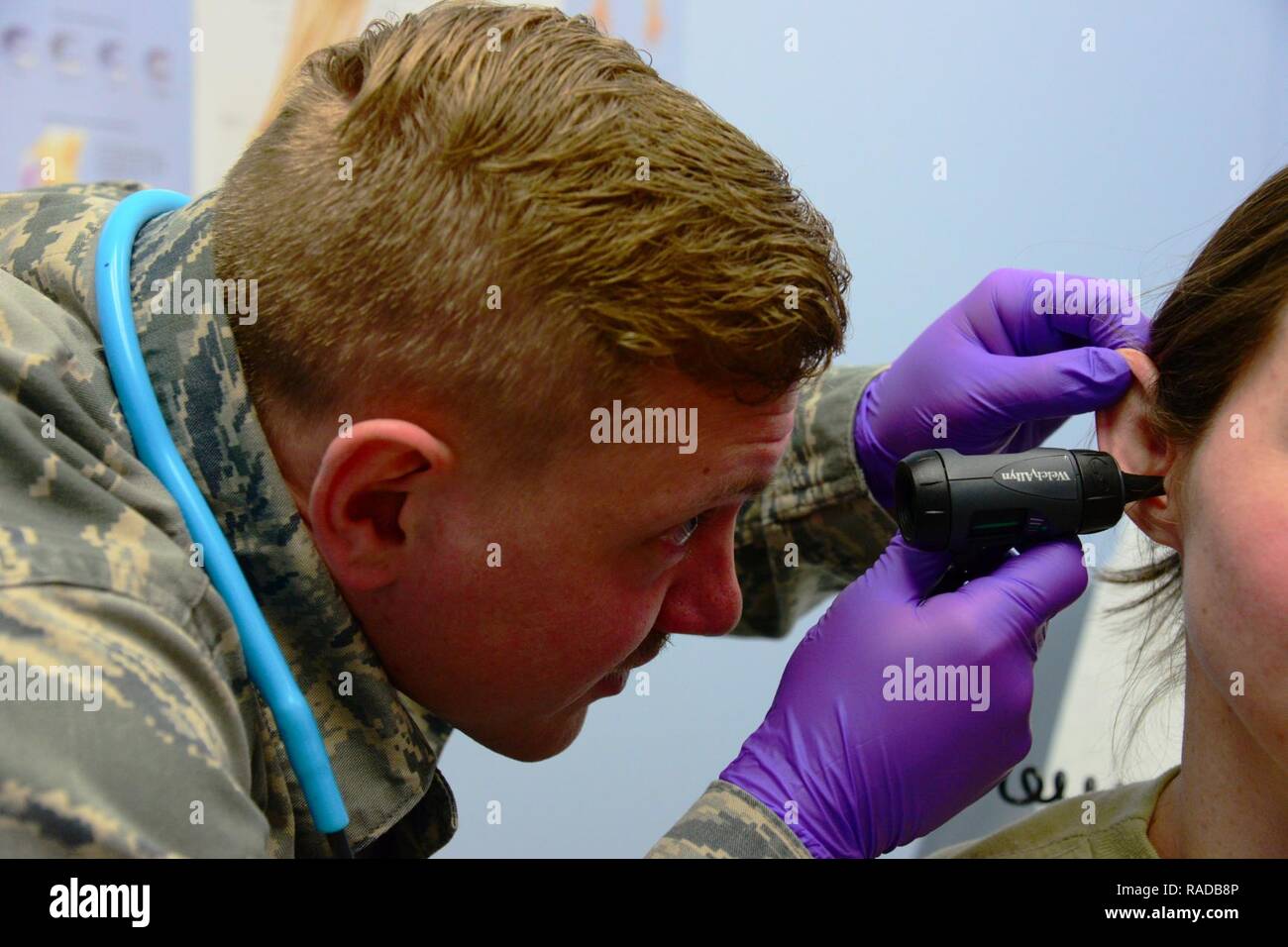Senior Airman Nathaniel Morris, 341st Medical Operation Squadron personnel reliability assurance program clinic technician, performs a preliminary vitals check on a simulated patient Jan. 30, 2017, at Malmstrom Air Force Base, Mont. PRAP technicians assist physicians with patients’ medical needs by measuring vitals, conducting a general health questionnaire upon a patient’s arrival, and in some cases are also trained on administering medical treatments once certified. Stock Photo
