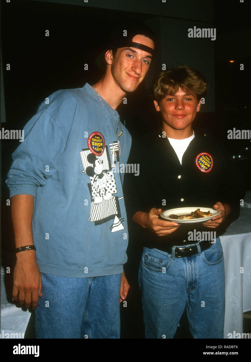 LOS ANGELES, CA - JULY 22: (L-R) Actor Dustin Diamond and actor Jason James Richter attend Ringling Brothers Barnum and Bailey Circus on July 22, 1993 at the Los Angeles Sports Arena in Los Angeles, California. Photo by Barry King/Alamy Stock Photo Stock Photo
