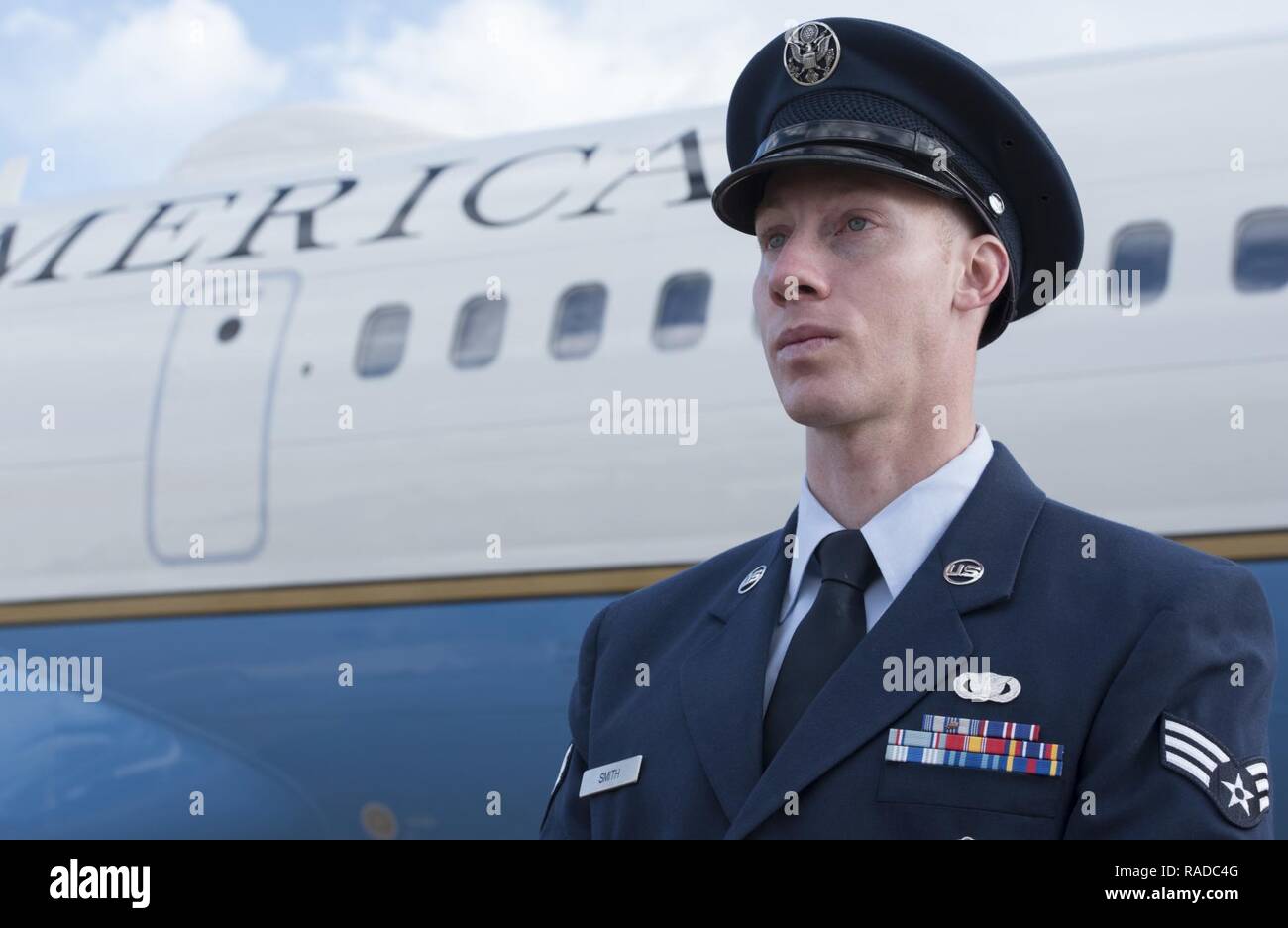 Senior Airman Joshua D. Smith, 811th Security Forces Squadron executive aircraft security team member, stands in front a Boeing C-32, at Joint Base Andrews, Md., Jan. 26, 2017. Smith provides discrete, low‐visibility security for the protection of Air Force aircraft transiting between airfields. This job includes accompanying traveling individuals like the vice president, secretary of defense, secretary of state, and senate and cabinet members. Stock Photo