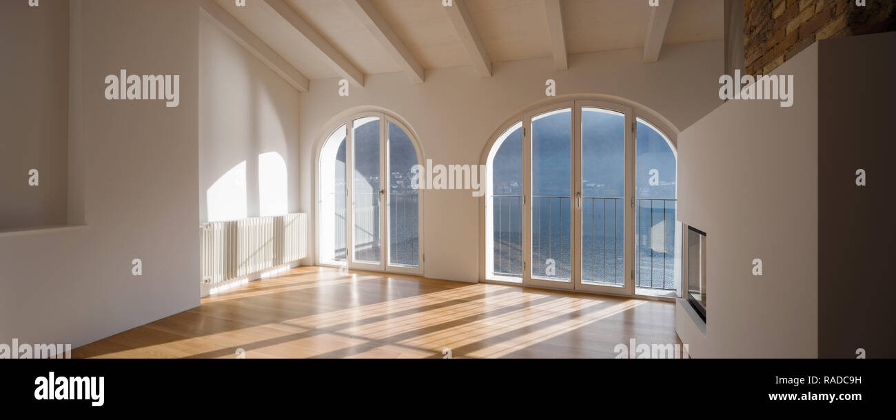 Modern Renovated Apartment With A Large Fireplace In The Middle Of