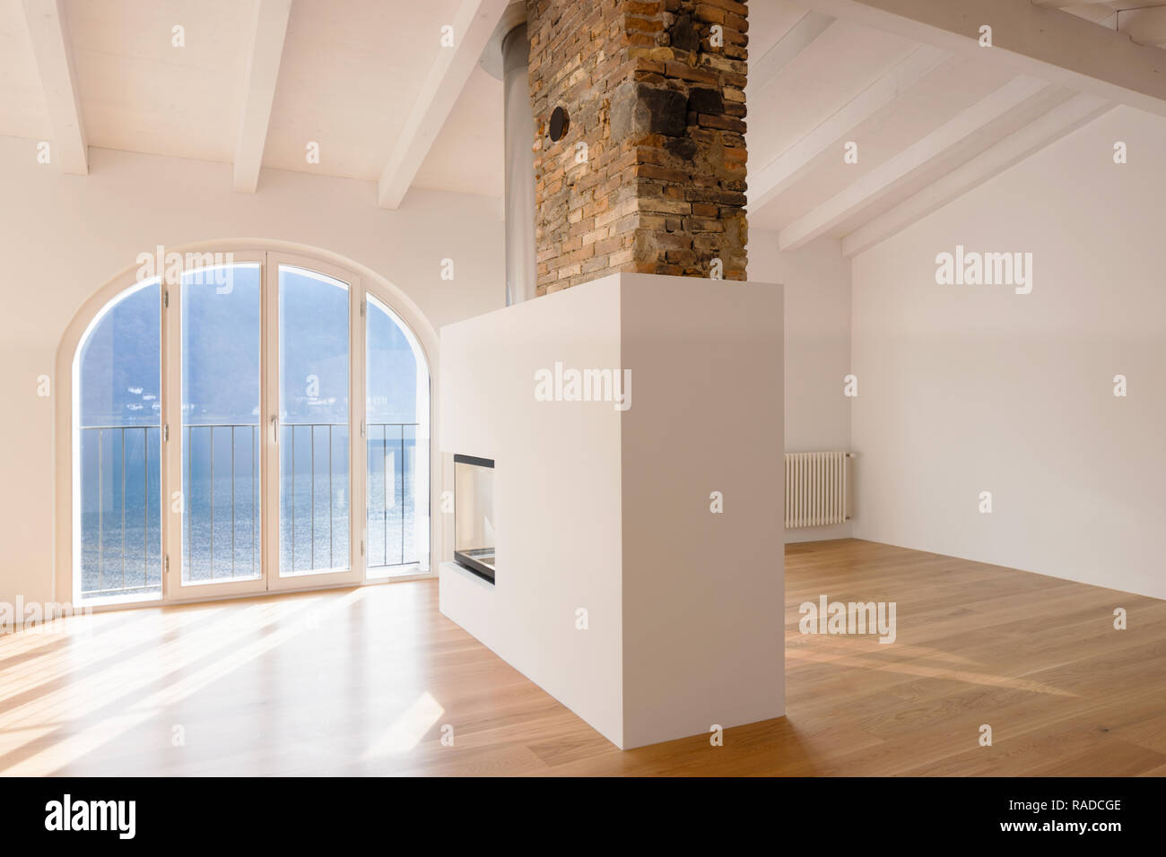 Modern Renovated Apartment With A Large Fireplace In The Middle Of