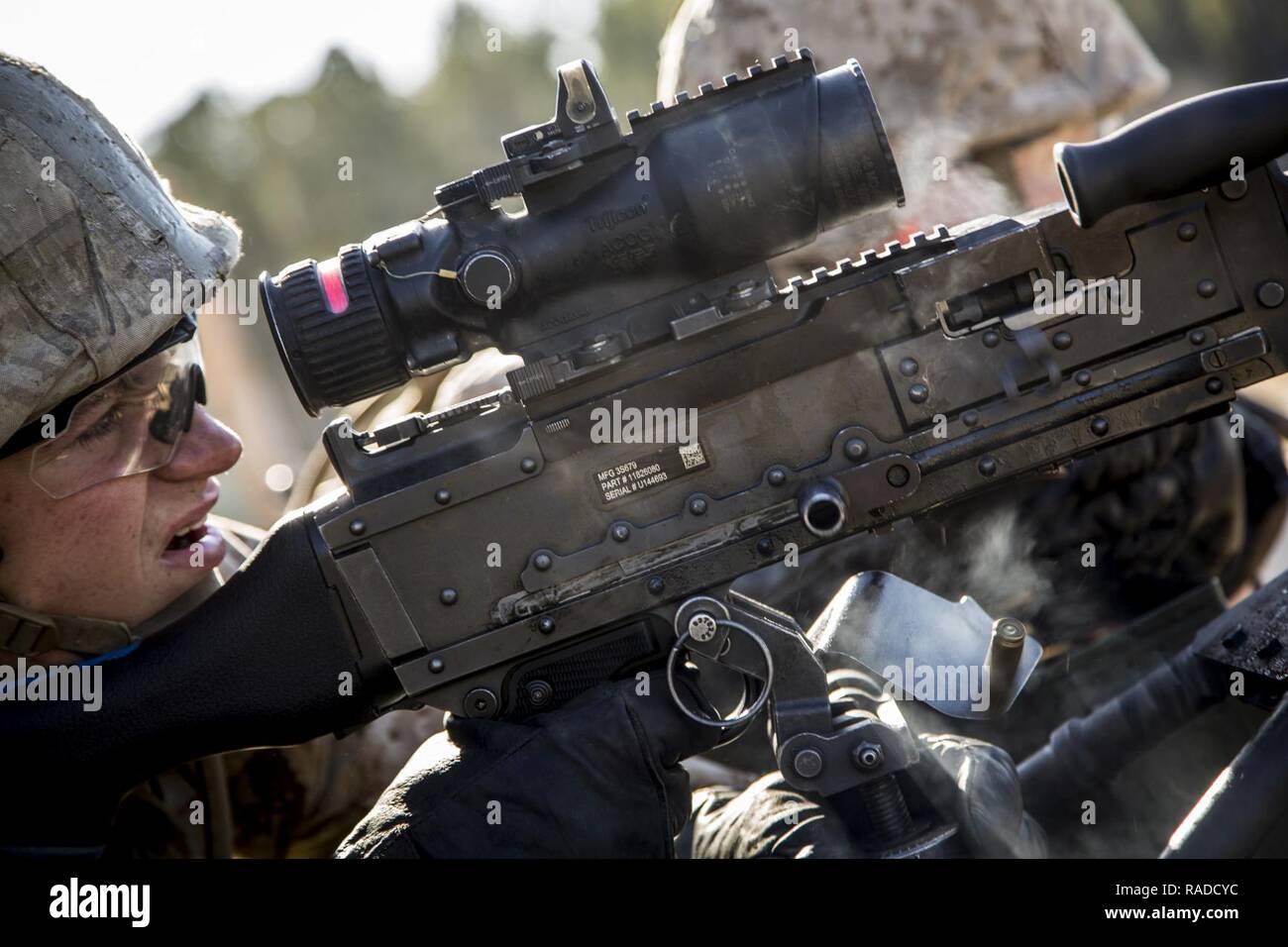 A U.S. Marine with Kilo Company, Marine Combat Training Battalion (MCT), School of Infantry-East, fires a M240G Medium Machinegun during a live fire exercise on Camp Lejeune, N.C., Jan. 13, 2017. Marines attending MCT conducted a live fire exercise to familiarize themselves with the weapon system. Stock Photo