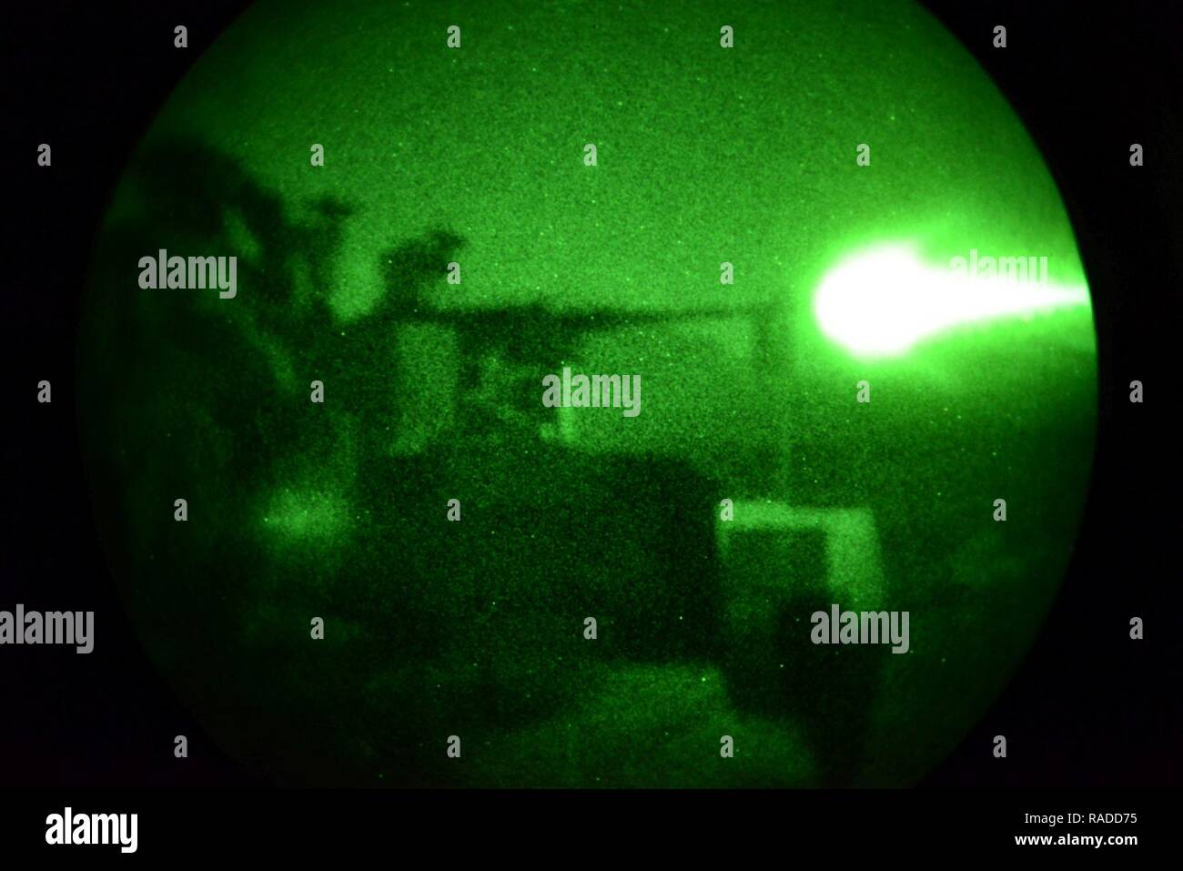 U.S. Army paratrooper from the 173rd Brigade Support Battalion, 173rd Airborne Brigade conduct night weapon qualification training with the .50-caliber machine gun during Exercise Lipizzaner III in Bac, Slovenia, on Jan. 25, 2017. Lipizzaner is a combined squad-level training exercise in preparation for platoon evaluation, and to validate battalion-level deployment procedures. Stock Photo