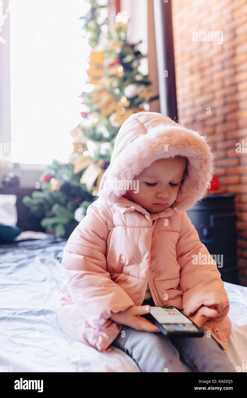 Baby Using Play Phone little baby play with smartphone alone Stock Photo - Alamy