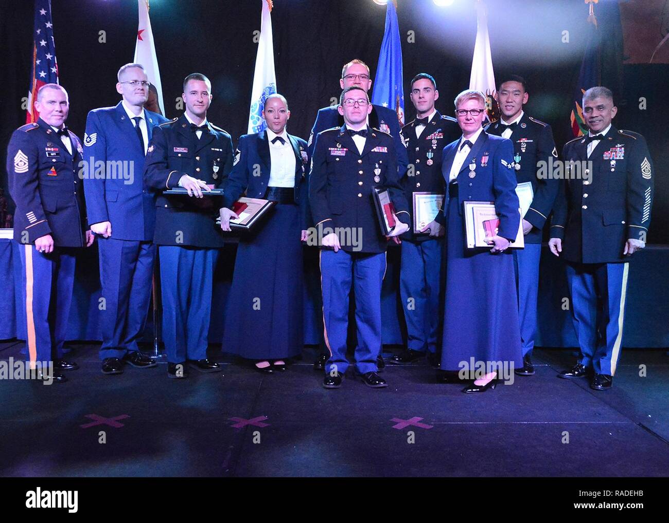 Selected airmen and soldiers comprised from California National Guard military departments in the state of California are recognized for their superior performance while competing for the title of Airman-Solider of the year at the Outstanding Airmen-Solider of the Year banquet, held at the Hilton San Diego Bayfront hotel, CA. January 28, 2016. The banquet is a one night celebration that succeeds a two day senior leadership conference. Winners and nominees of the award ceremony are recognized as they walk across a large stage in front of a large audience of their peers, while being congratulate Stock Photo