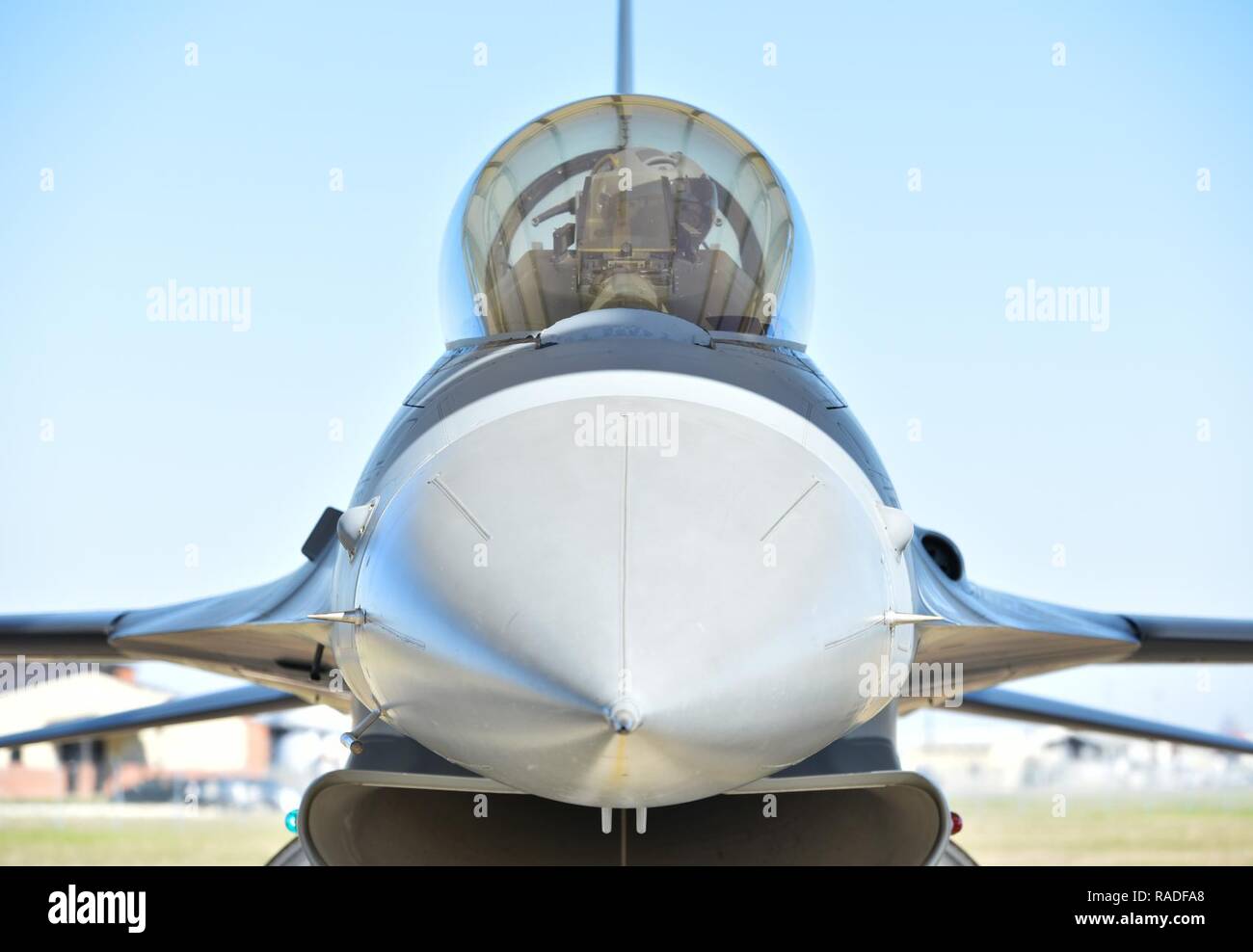 A student pilot assigned to the 149th Fighter Wing checks the controls of an F-16 Fighting Falcon during a pre-flight inspection at Joint Base San Antonio-Lackland, Texas, Feb. 1, 2017. The 149th FW's primary federal mission is to train pilots to operate and fly the F-16. Stock Photo