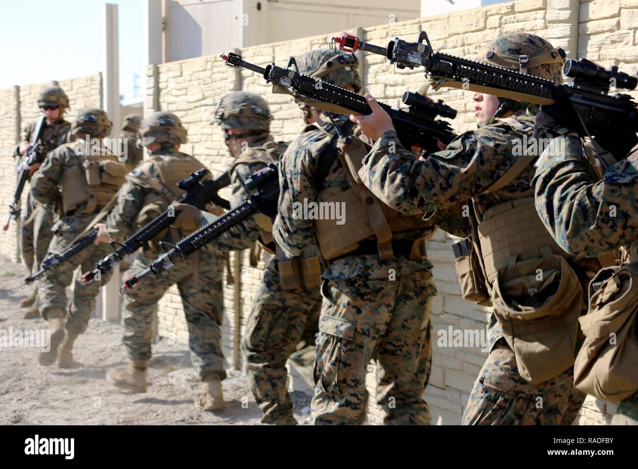 Marine Stack Course Marines stack and maneuver around a wall during Military Operations in ...