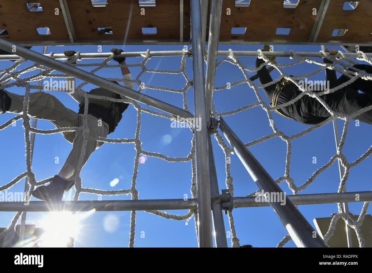 Members of the Richland County Sheriff's Department participate in the first “Battle Challenge” at McCrady Training Center in Eastover, S.C., Jan. 28, 2017. The Battle Challenge is a mobile obstacle course requiring participants to perform nine tasks under pressure of time, including a cargo net climb, a knotted rope descent, wall surmount, ammunition resupply, low crawl, gas can carry, marksmanship tasks, and a service member-down rescue. The event was open to all military service members, law enforcement, first responders, firefighters, protective services and their 18 and older family membe Stock Photo