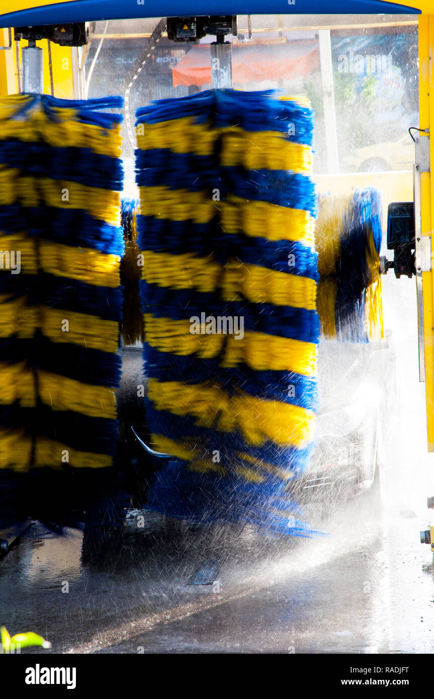 The automated carwash striped in yellow and blue color Stock Photo Alamy
